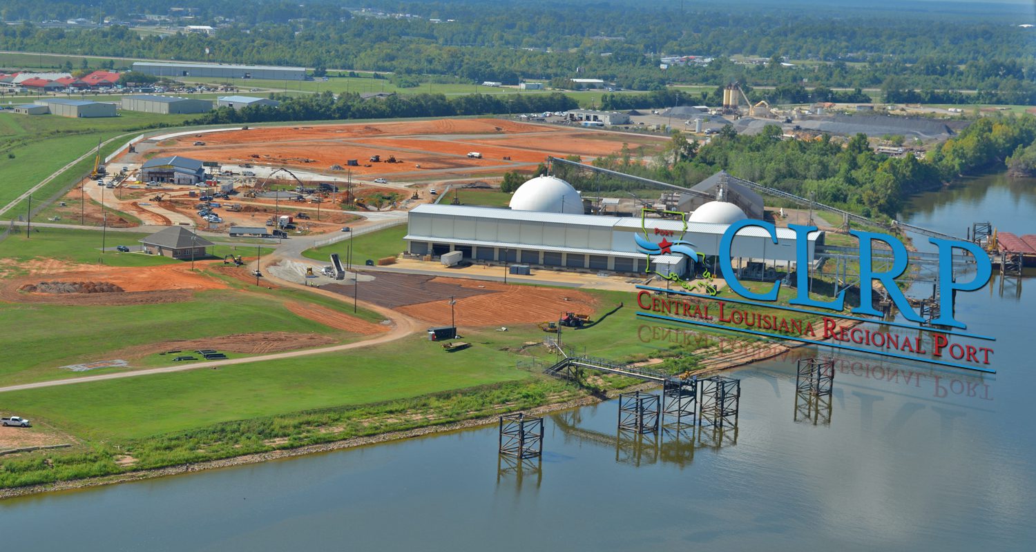 Aerial view of the central louisiana regional port facilities with industrial buildings, construction areas, and adjacent waterway.